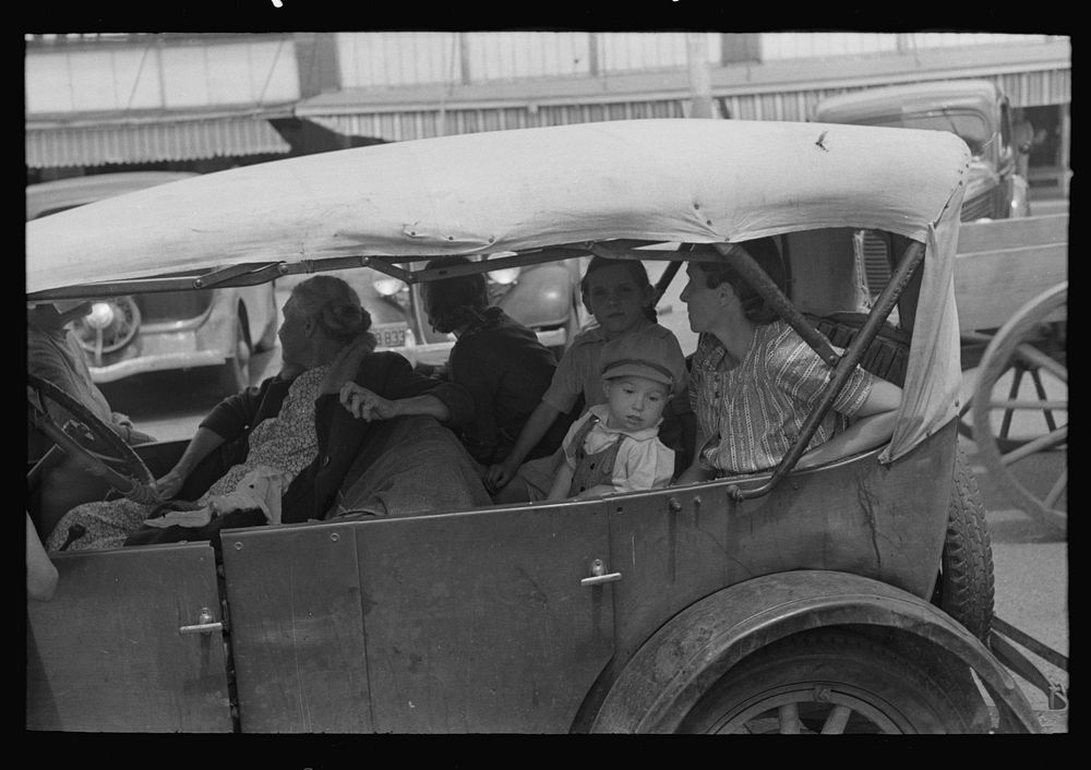 Farm people in automobile in town Saturday afternoon, San Augustine, Texas by Russell Lee