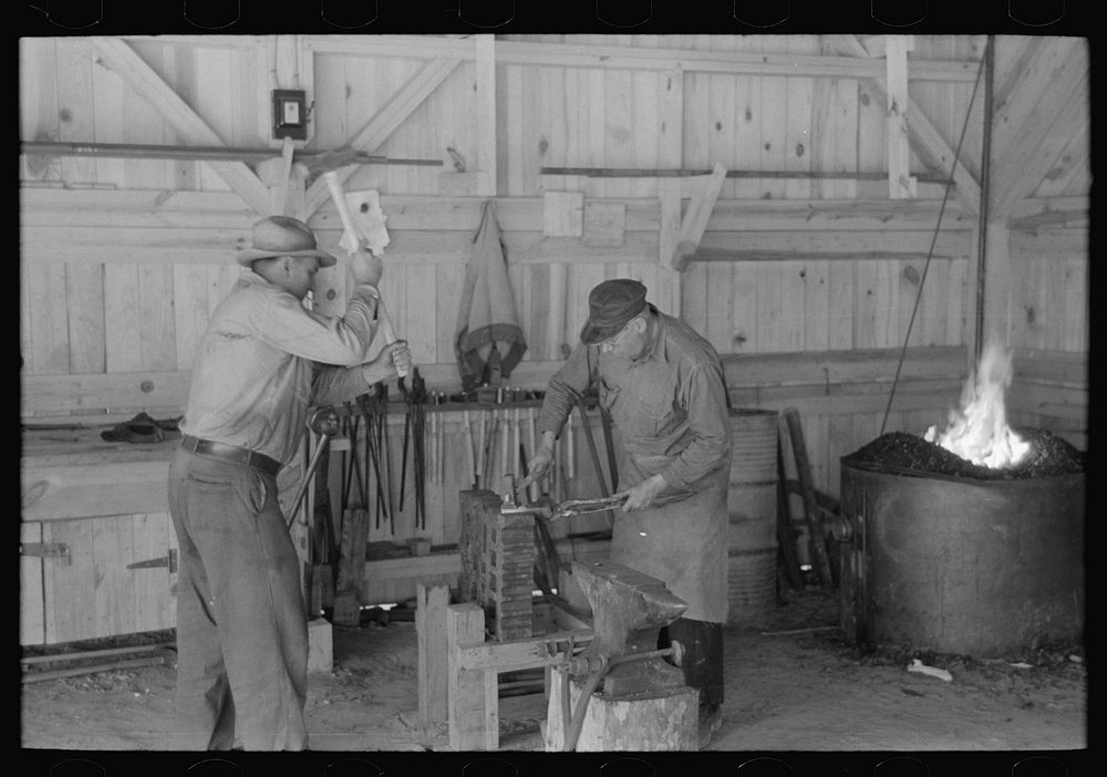 Blacksmith shop, Southern Paper Mill construction shed, Lufkin, Texas by Russell Lee