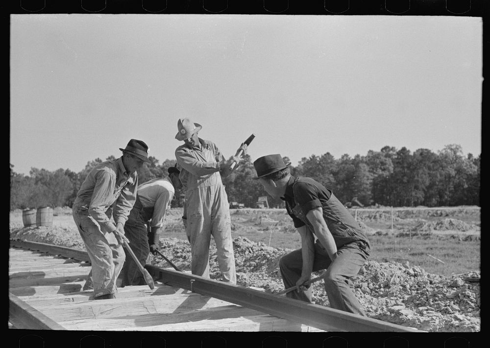 [Untitled photo, possibly related to: Railroad gang, Southern Paper Mill construction crew, Lufkin, Texas] by Russell Lee