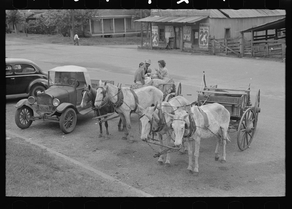 Farmers' vehicles parked near courthouse, Saturday afternoon, San Augustine, Texas by Russell Lee