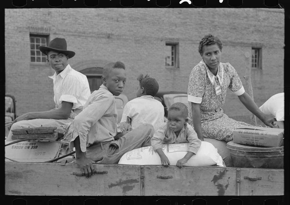 [Untitled photo, possibly related to: Family with supplies in wagon ready to leave for the farm, Saturday afternoon, San…