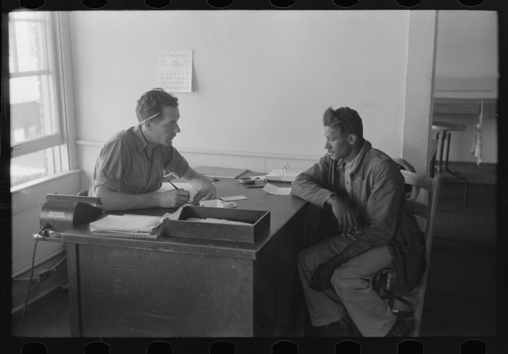 [Untitled photo, possibly related to: FSA (Farm Security Administration) client talking to supervisor, Sabine Farms…