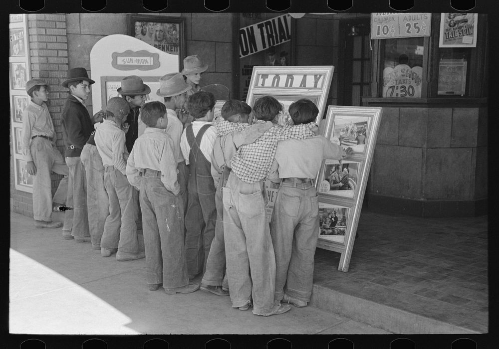 Children in front of moving picture show, Alpine, Texas by Russell Lee