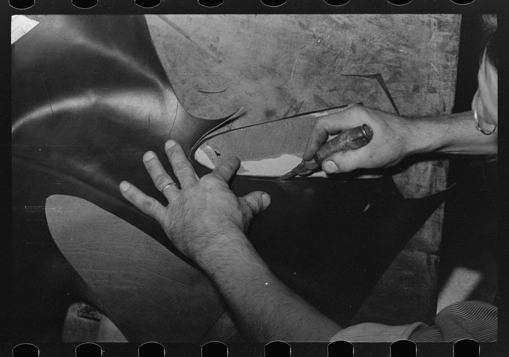 [Untitled photo, possibly related to: Outside grooving of inner sole in process of making welt. Bootmaking shop, Alpine…
