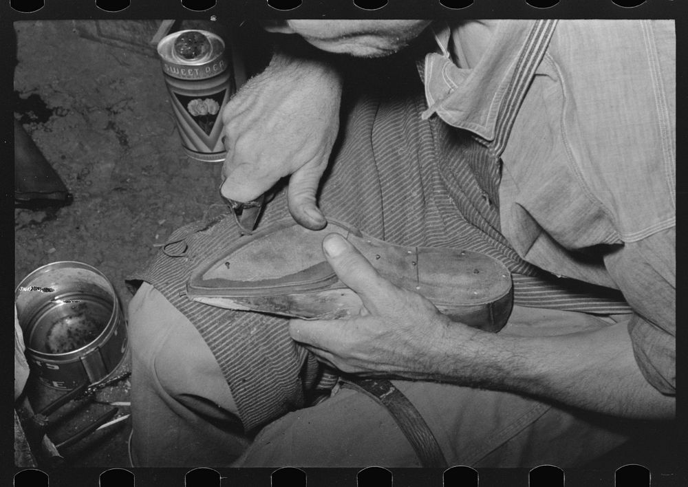 Outside grooving of inner sole in process of making welt. Bootmaking shop, Alpine, Texas by Russell Lee