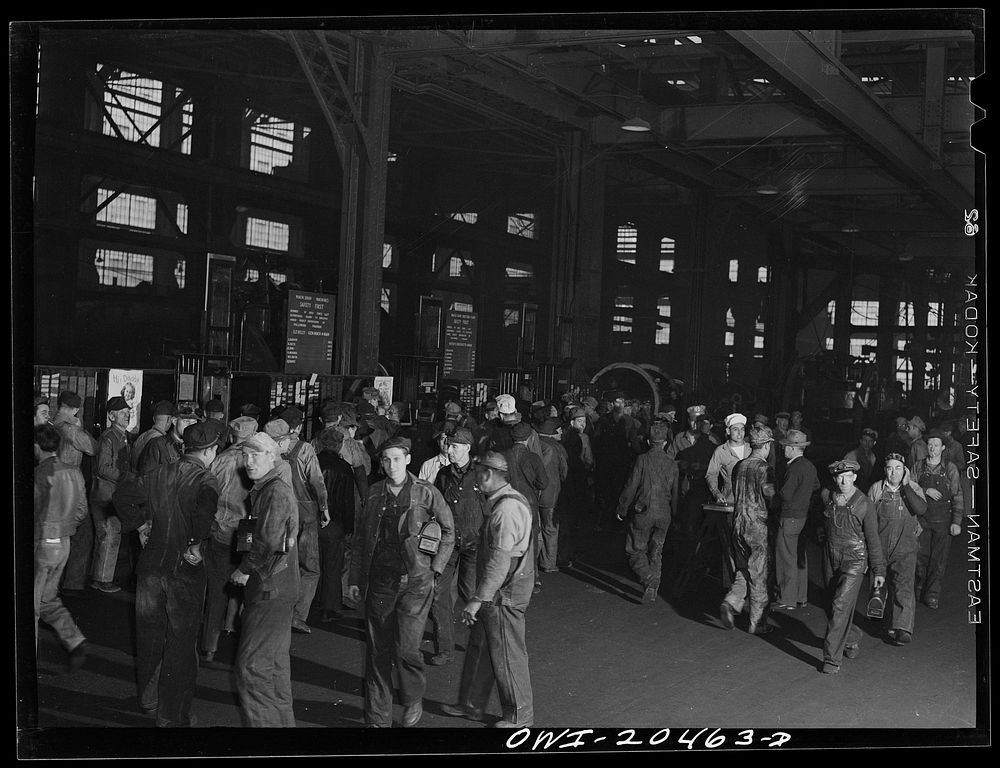 Albuquerque, New Mexico. Men checking out for lunch at the Atchison, Topeka and Santa Fe locomotive shops. Sourced from the…
