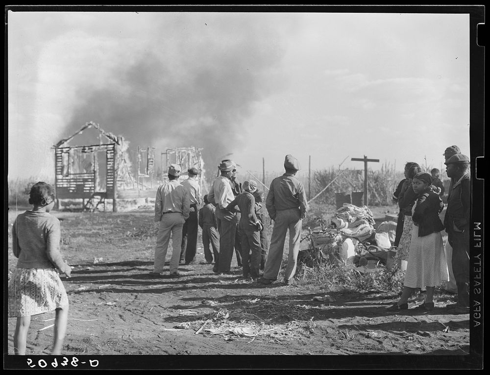 [Untitled photo, possibly related to:  agricultural laborers watching one of their houses burn to the ground. All they have…
