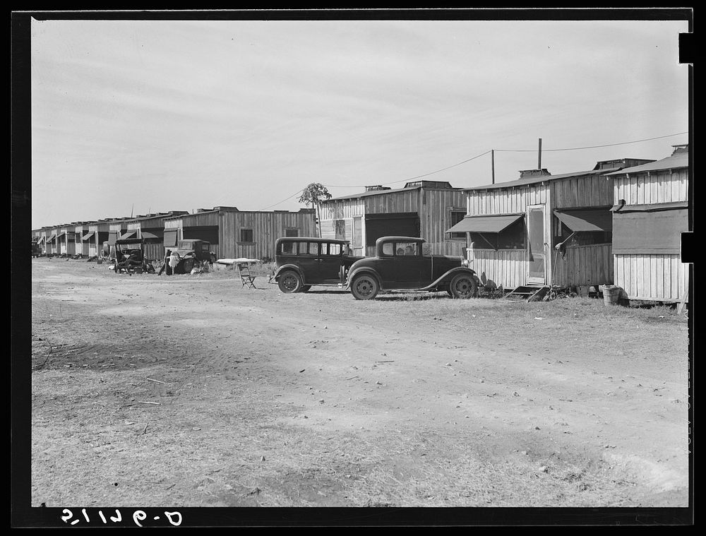 Migratory laborers' camp. Single-room cabin costs two dollars and fifty cents, double room four dollars per week. Water…