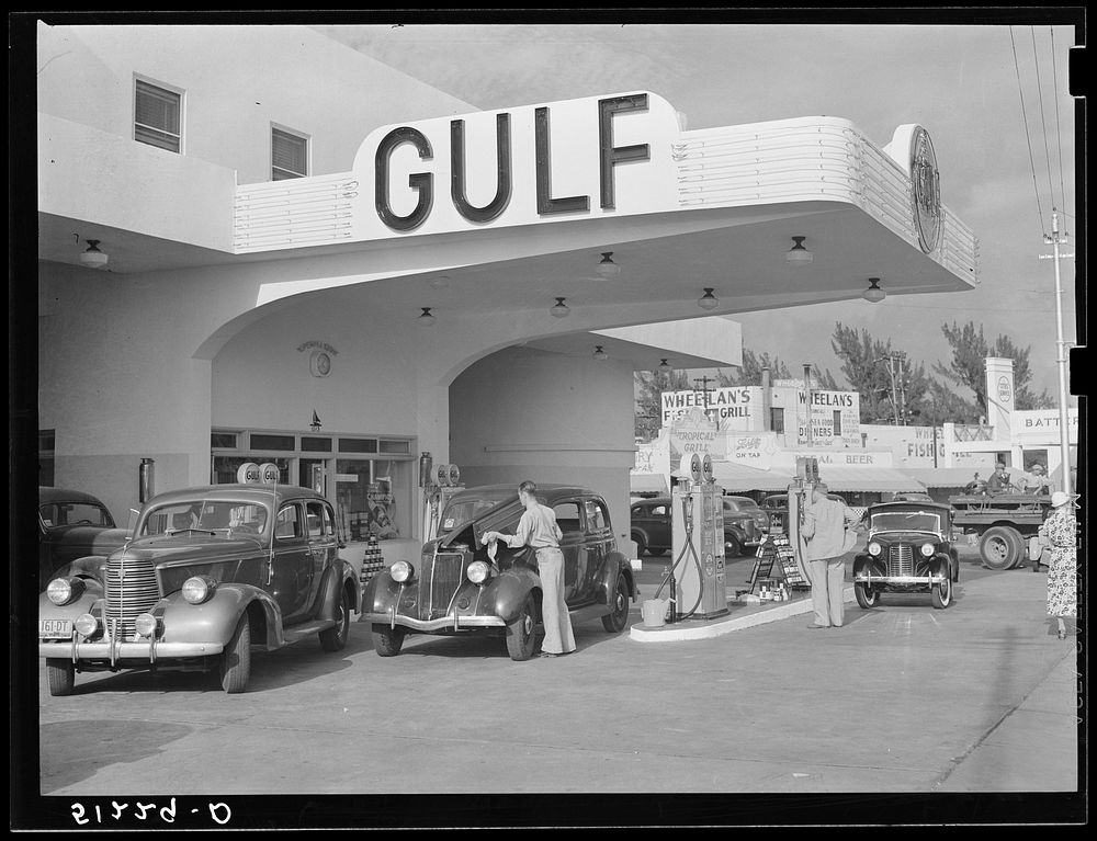 Even the gas stations are on an elaborate scale, often modern in design, resembling hotels. Miami Beach, Florida. Sourced…