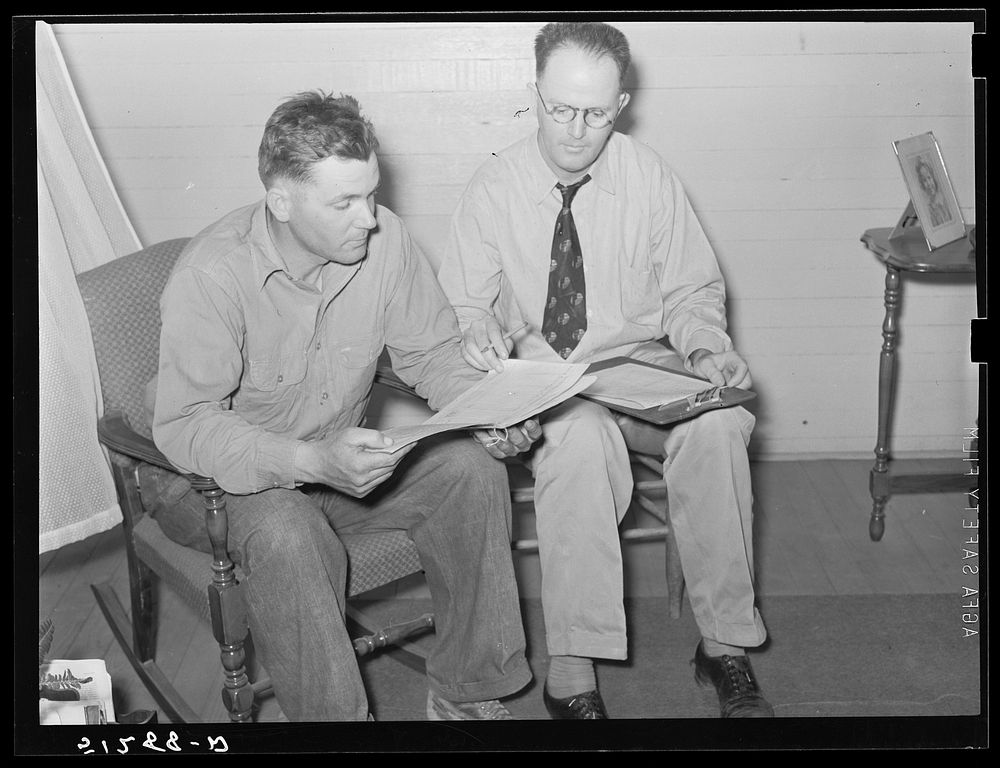 Mrs. Helms working out farm plan with FSA (Farm Security Administration) supervisor. Coffee County, Alabama. Sourced from…