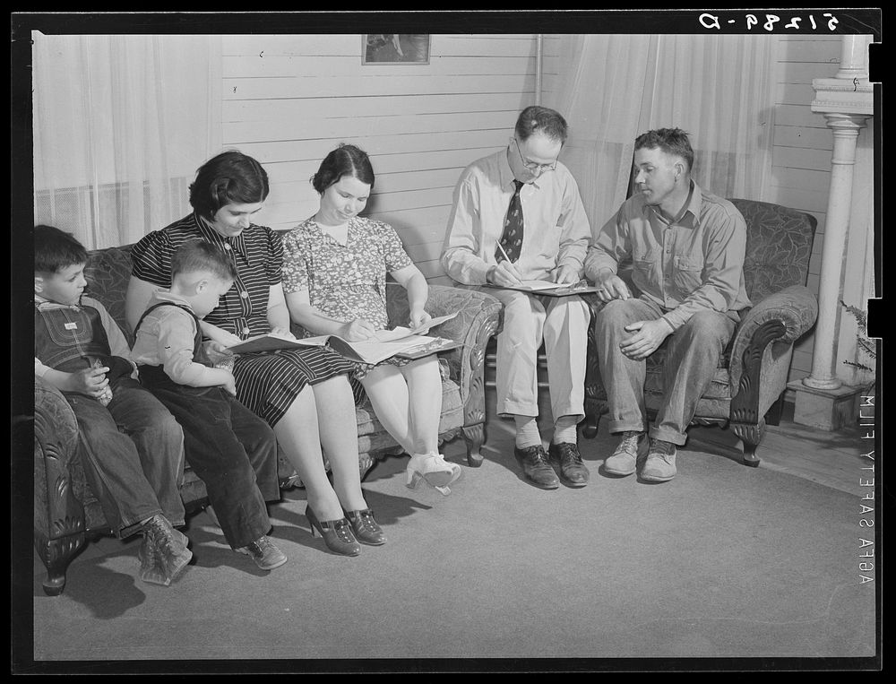 Helms family working out farm and home plan with FSA (Farm Security Administration) supervisor. Coffee County, Alabama.…
