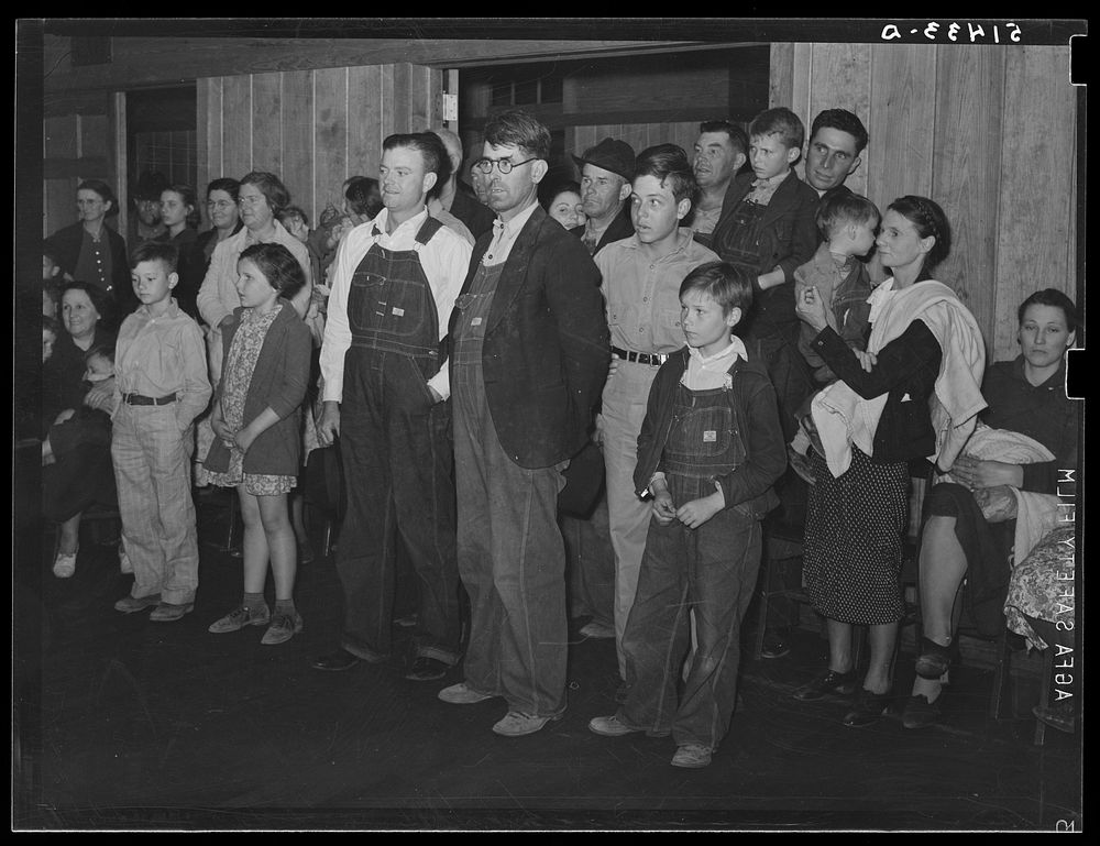 Group of rural people, including FSA (Farm Security Administration) clients watching recreational singing games at Mount…