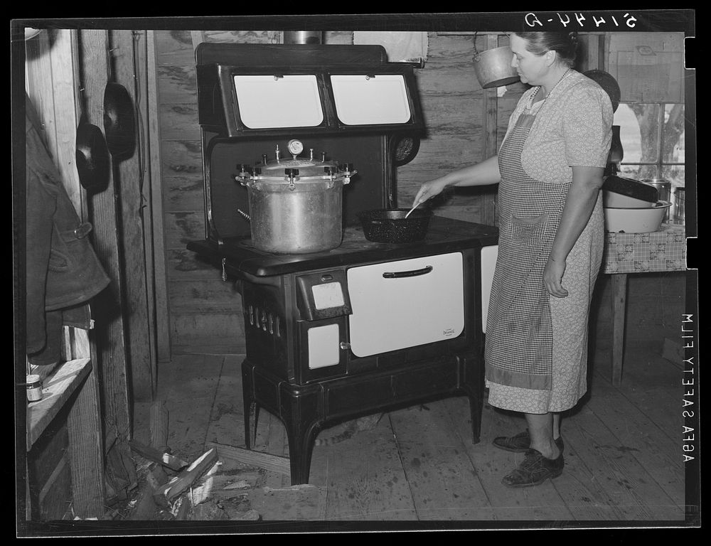 Pressure cooker on Mrs. L.L. LeCompt's new stove bought through FSA (Farm Security Administration) loan. Coffee County…