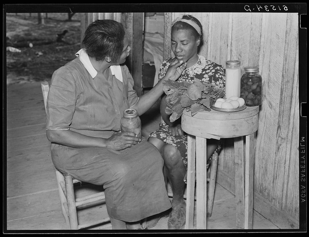 [Untitled photo, possibly related to: Nurse Shamburg gives Viola Pettway instructions and help about her diet in treatment…