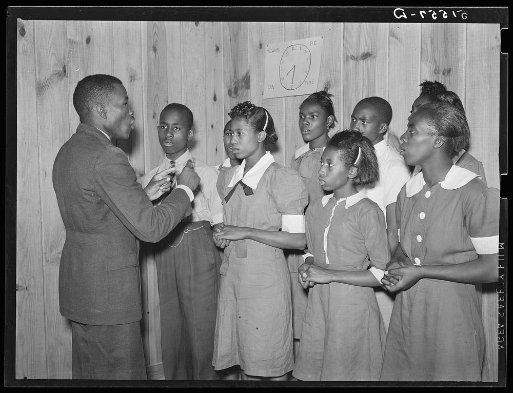 School choir led by Robert Pierce, school principal. They won state championship. Gee's Bend, Alabama. Sourced from the…