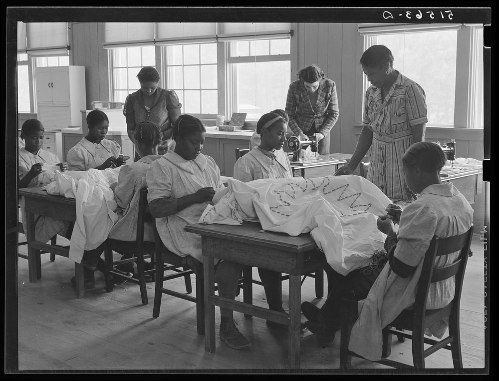 [Untitled photo, possibly related to: NYA (National Youth Administration) girls making bedspreads under supervision of…