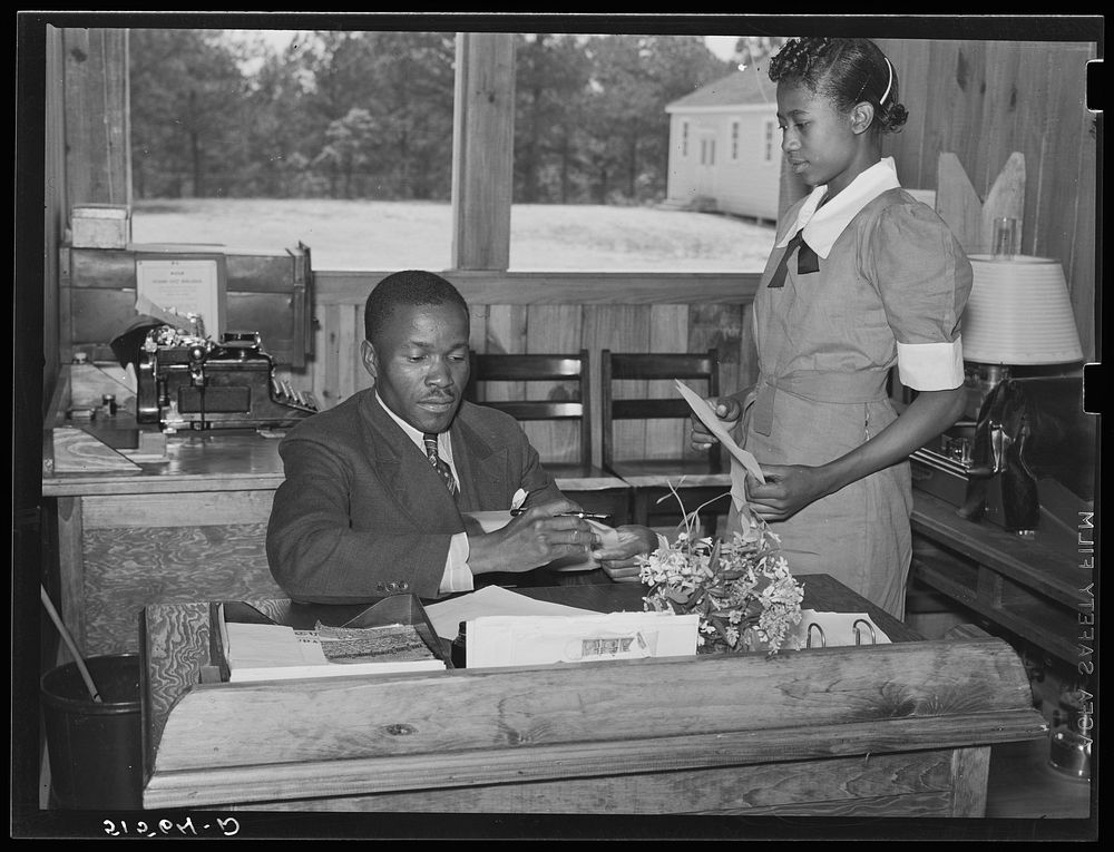 Students learn office and secretarial work by helping principal Robert Pierce. Gee's Bend, Alabama. Sourced from the Library…