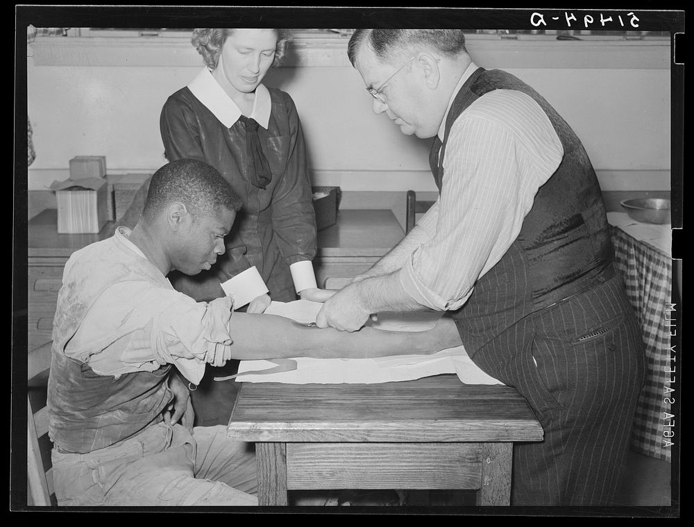 Miss Teal, nurse, and doctor W.R. Stanley giving treatment in veneral disease clinic. Enterprise, Coffee County, Alabama.…
