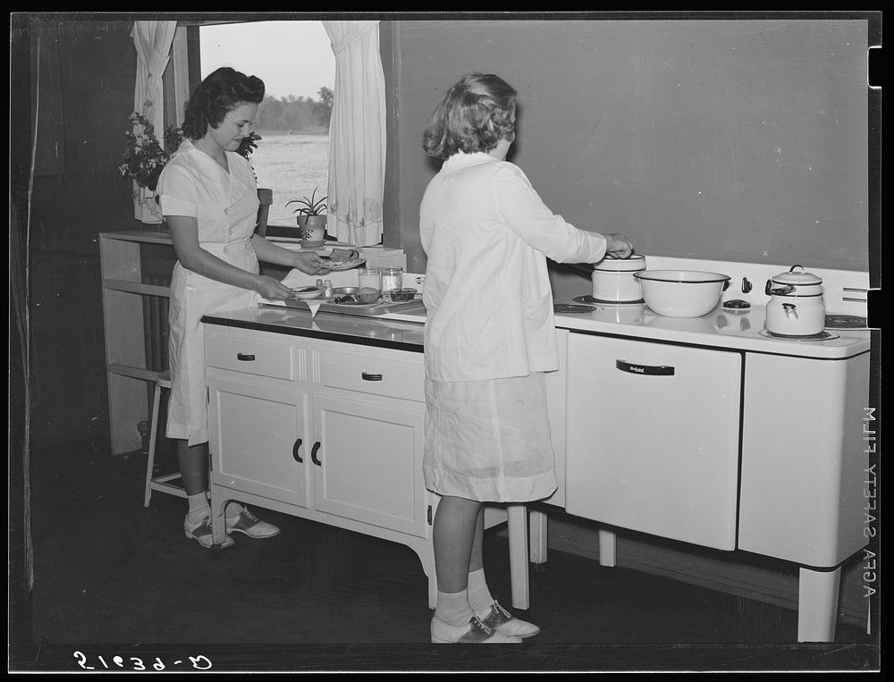 [Untitled photo, possibly related to: Margaret Segars at sink with dinner tray showing well-balanced meal at right. In…