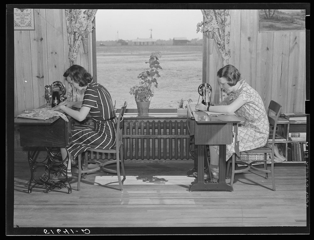 Jane McCutcheon and Ruth Lee Hear at sewing machines in home economics classroom.  School building, Ashwood Plantations…