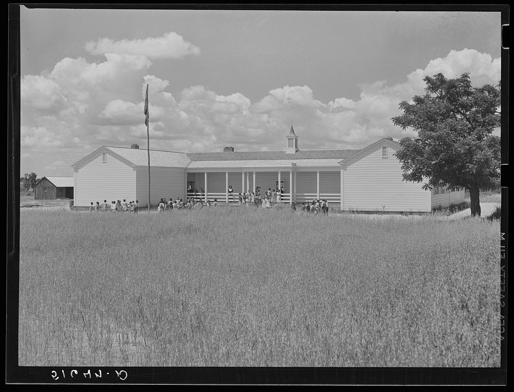 School building, with oats planted in foreground until landscaping can be done. Flint River Farms, Georgia. Sourced from the…