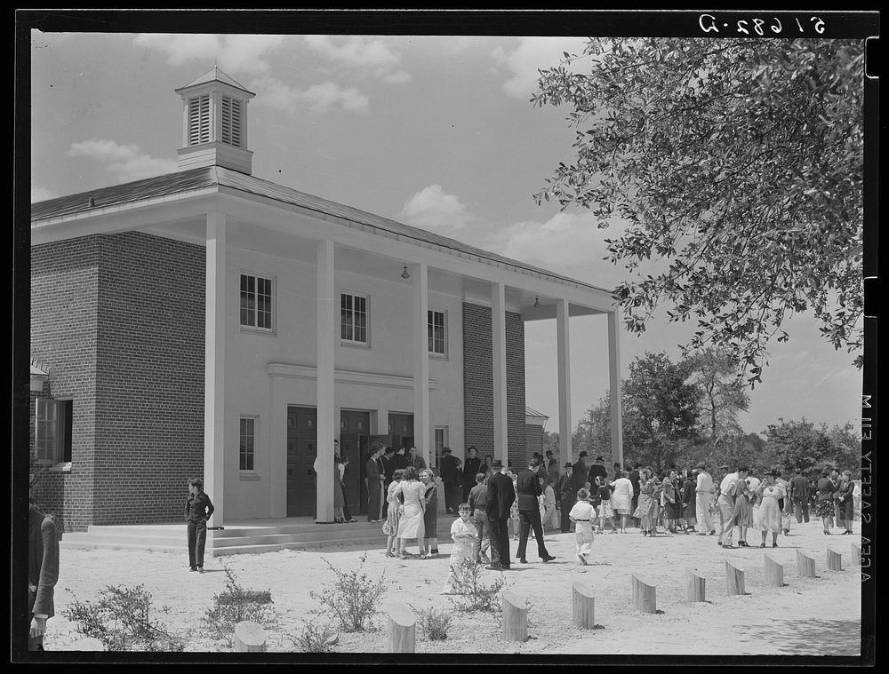 Project families, guests and schoolchildren leaving auditorium for picnic after May Day-Health Day program at Ashwood…