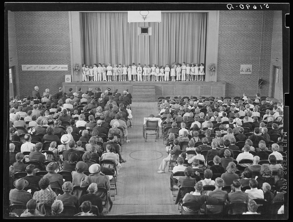 First grade children singing health song in May Day-Health Day program in auditorium. Ashwood Plantations, South Carolina.…
