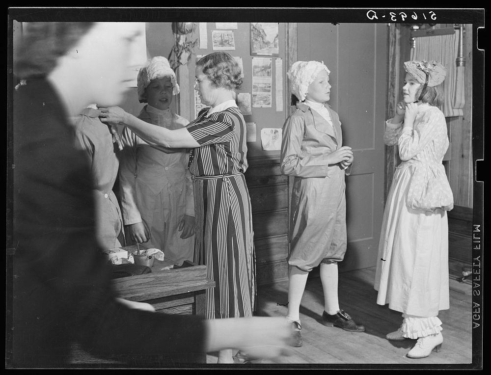 [Untitled photo, possibly related to: The sixth and seventh grades being made up for their colonial play and dance (tied in…