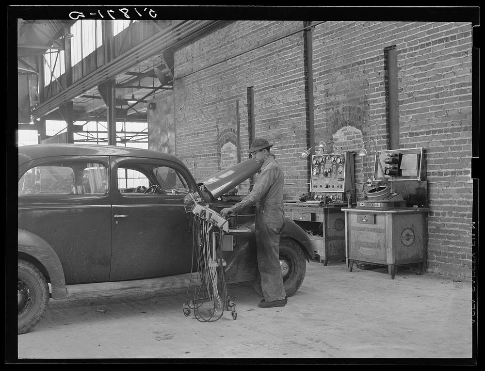 Testing motors of car in FSA (Farm Security Administration) warehouse depot. Atlanta, Georgia. Sourced from the Library of…