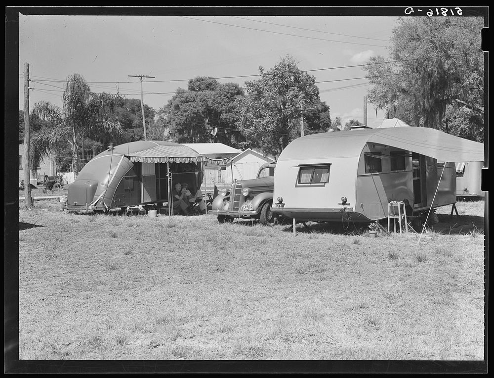 [Untitled photo, possibly related to: Tourist camp, showing many modern trailers crowded together, some of the families…