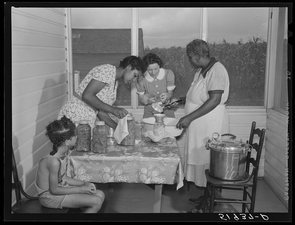 FSA (Farm Security Administration) home supervisor assisting wife and daughter of Frederick Oliver, tenant purchase client…