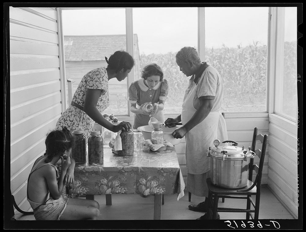 [Untitled photo, possibly related to: FSA (Farm Security Administration) home supervisor assisting wife and daughter of…