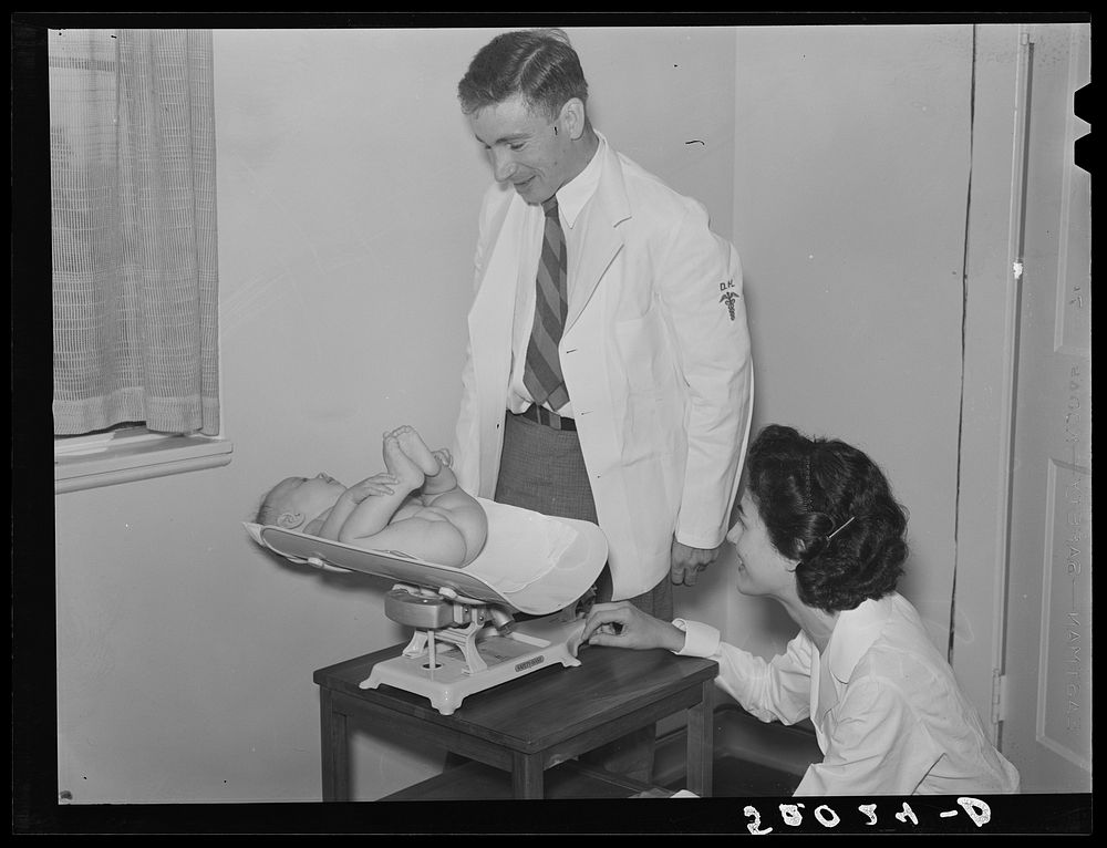 Weighing baby at medical center. Greenbelt, Maryland. Sourced from the Library of Congress.