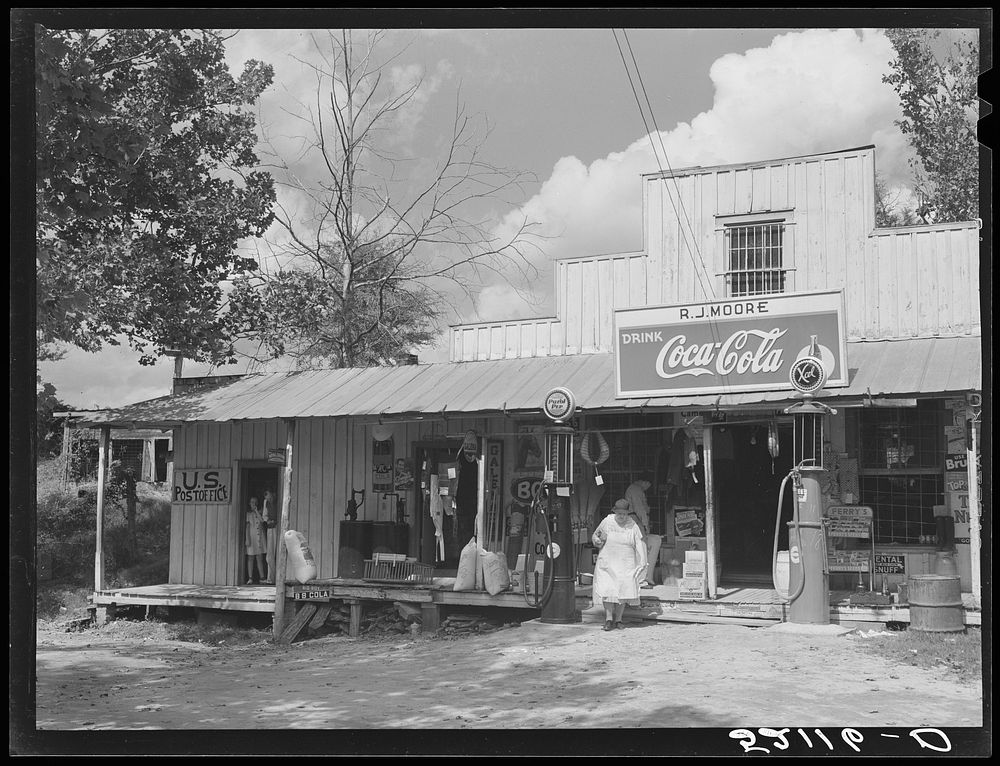 Post office in general store and filling station. Bynum, Wake County, North Carolina. Highway 15. Sourced from the Library…