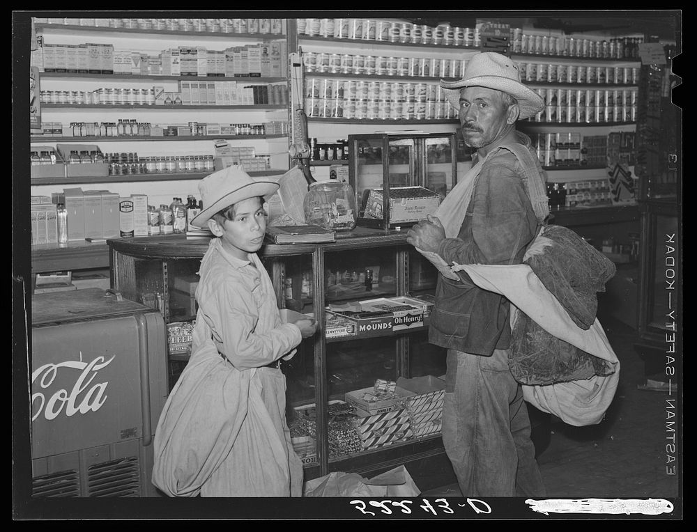 [Untitled photo, possibly related to: Mexican cotton pickers inside plantation store. Knowlton Plantation, Perthshire…
