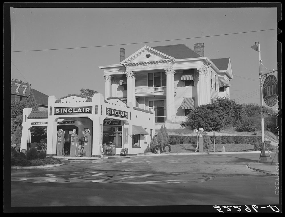 Gas station in front of old colonial house. Jackson, Mississippi Delta Mississippi. Sourced from the Library of Congress.