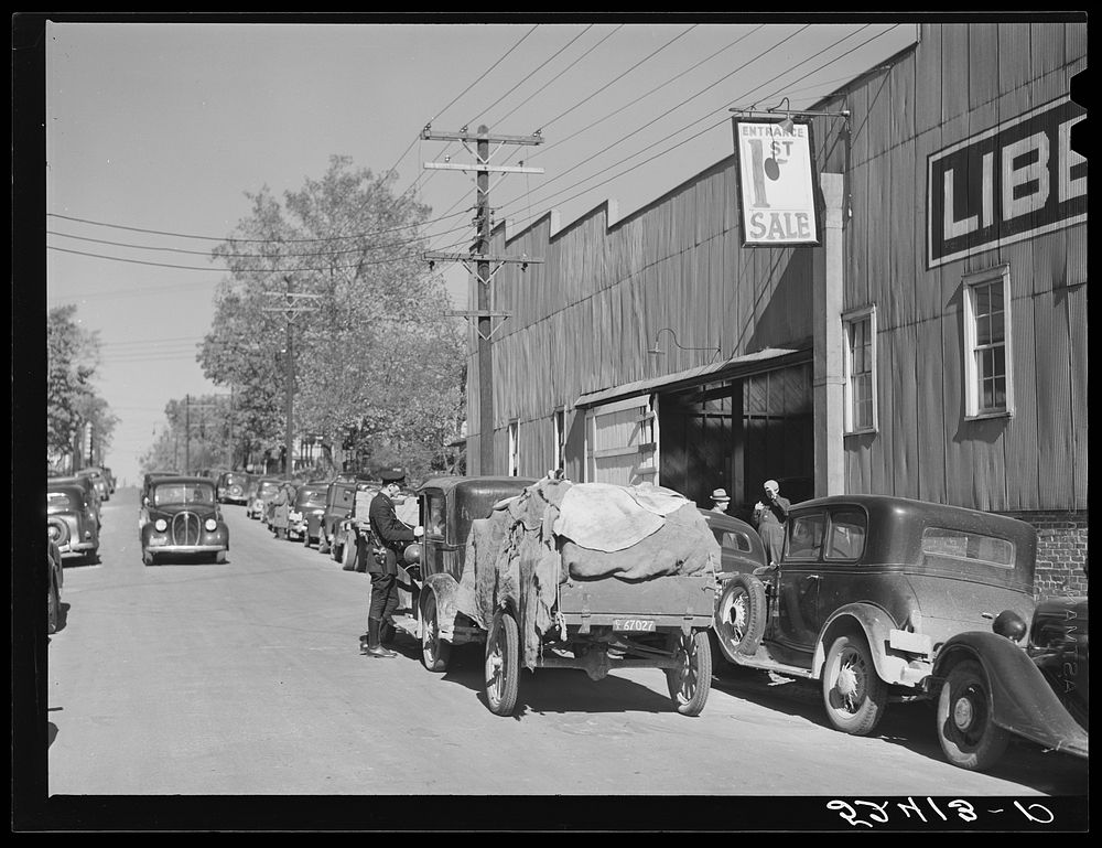 Tobacco coming in trailers to the warehouse for auction sale. Durham, North Carolina. Sourced from the Library of Congress.