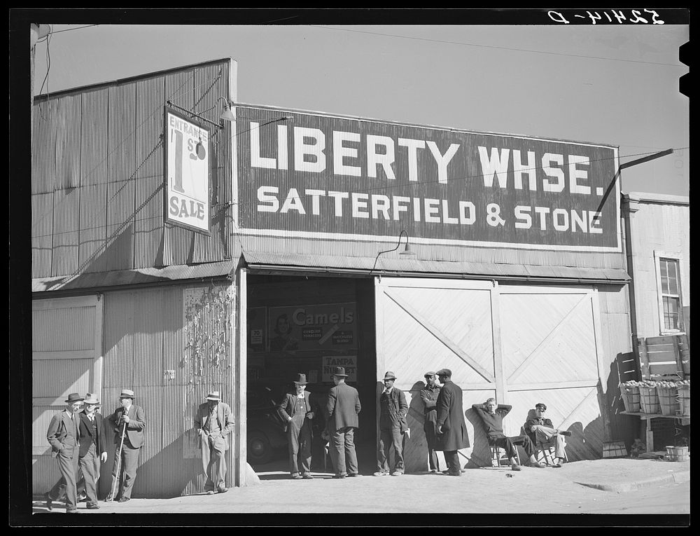Outside tobacco warehouse during auction sale. Durham, North Carolina. Sourced from the Library of Congress.