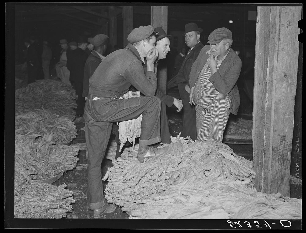 Farmers waiting around at tobacco auction. Durham, North Carolina. Sourced from the Library of Congress.