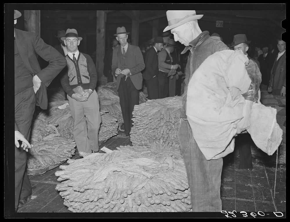 [Untitled photo, possibly related to: Farmers waiting around at tobacco auction. Durham, North Carolina]. Sourced from the…