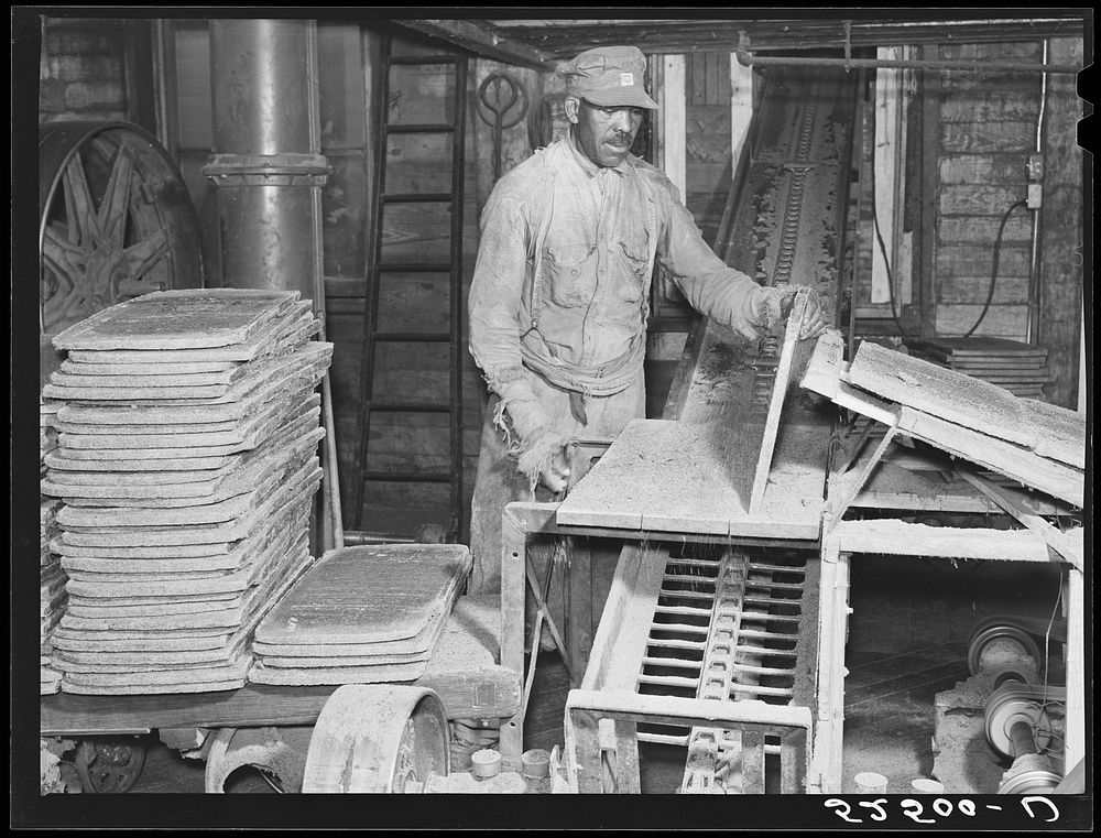 [Untitled photo, possibly related to: Cakes of cottonseed meal which is fed to cattle in oil plant. Clarksdale, Mississippi…