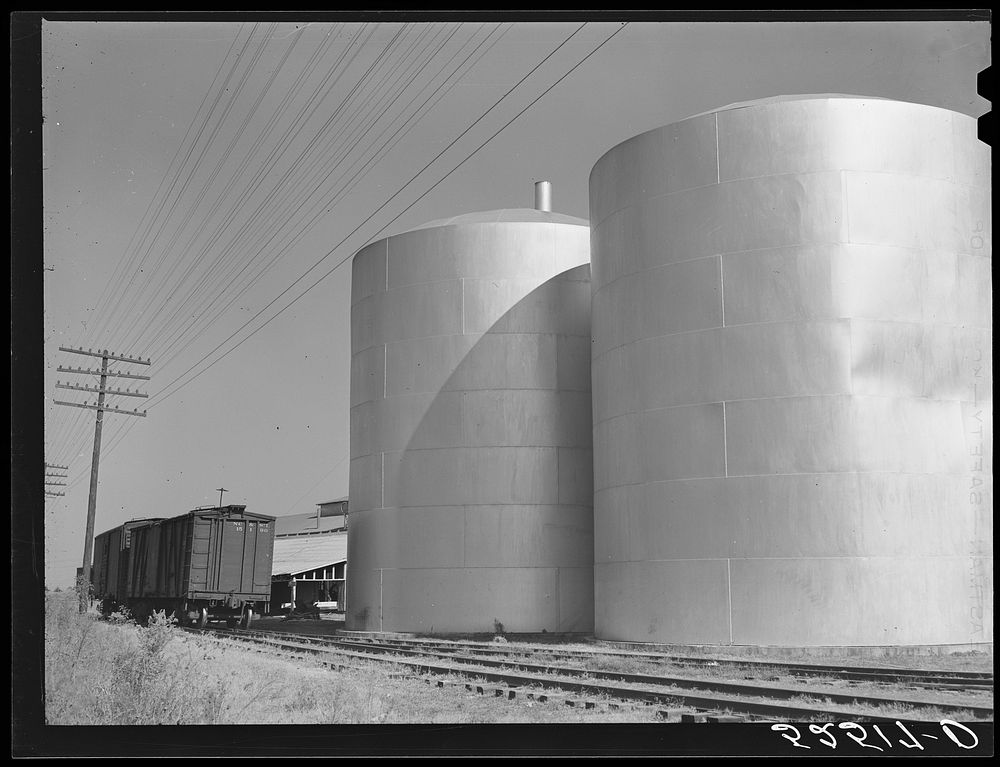 Tanks of cottonseed oil outside plant. Clarksdale, Mississippi, Delta. Sourced from the Library of Congress.