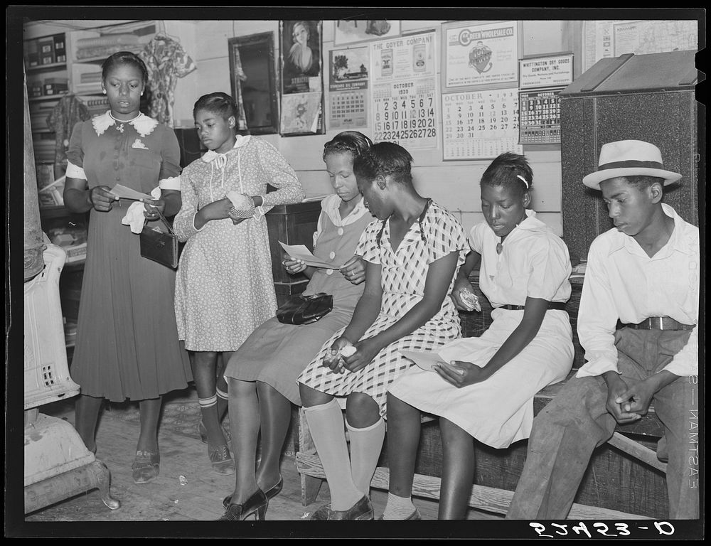 es help each other read their mail in plantation store on Saturday morning. Mileston Plantation, Mississippi Delta. Sourced…