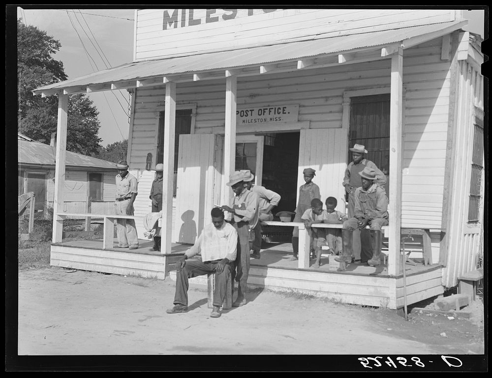 [Untitled photo, possibly related to: es cut each others' hair in front of plantation store after being paid off on…