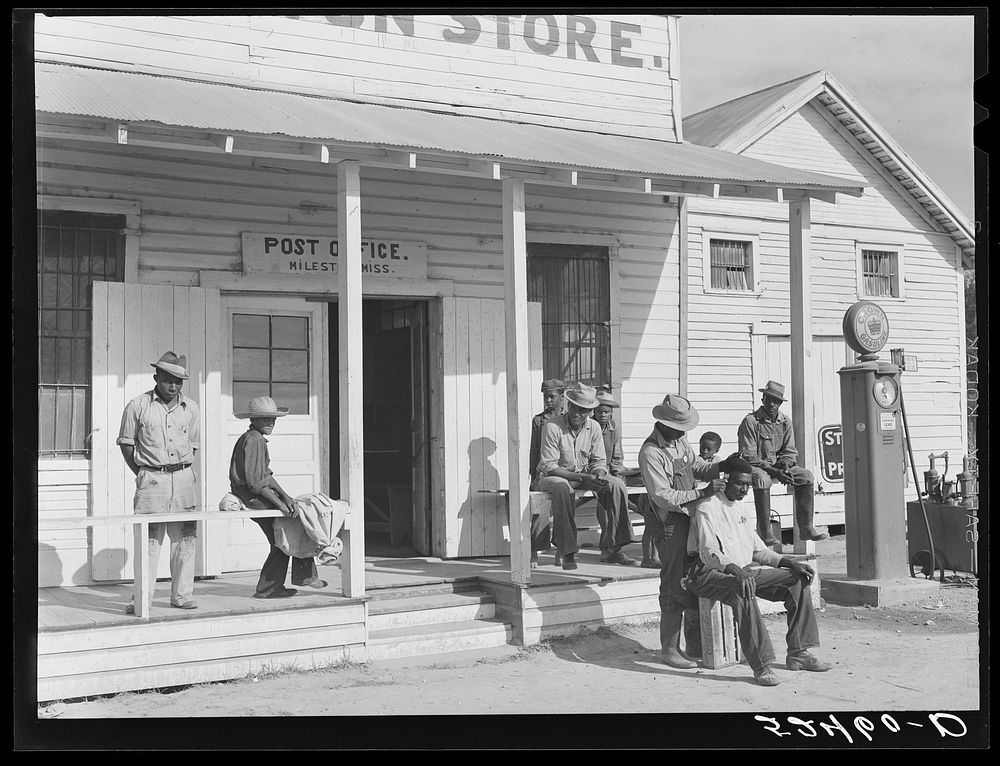 es cut each others' hair in front of plantation store after being paid off on Saturday. Mileston Plantation, Mississippi…