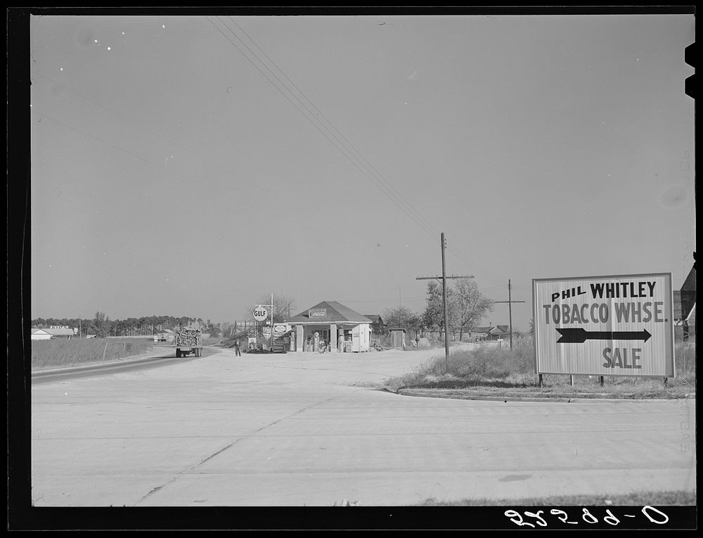 Intersection on main highway with road turning off to right for Wendell. Wake County, North Carolina. Sourced from the…