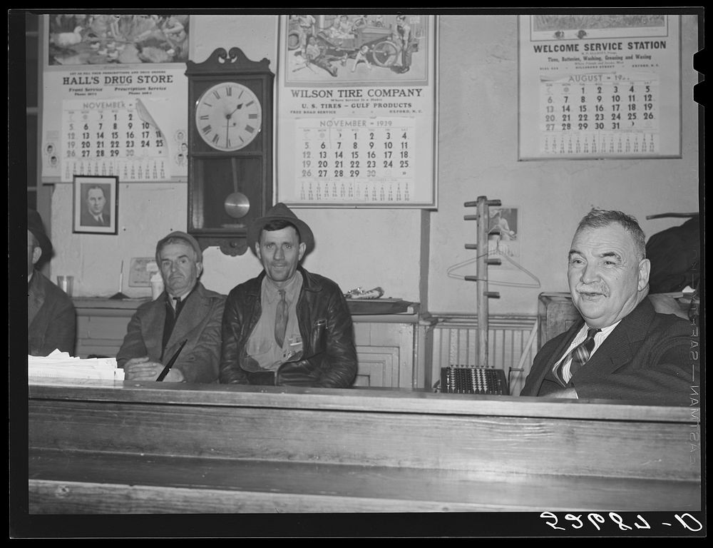 Sheriff Graham and two farmers killing time during dinner hour in his office on court day in Granville County Courthouse.…