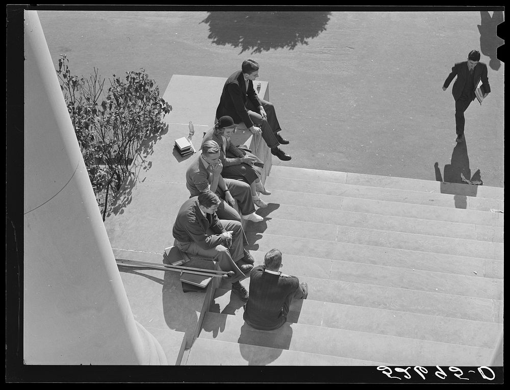 [Untitled photo, possibly related to: Students on steps of building between classes. University of North Carolina, Chapel…