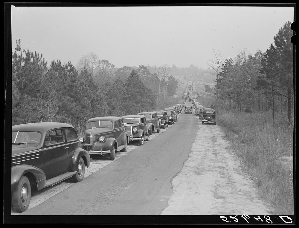 Cars parked along the highways on day of Duke-Carolina football game, near Duke University Stadium. Sourced from the Library…