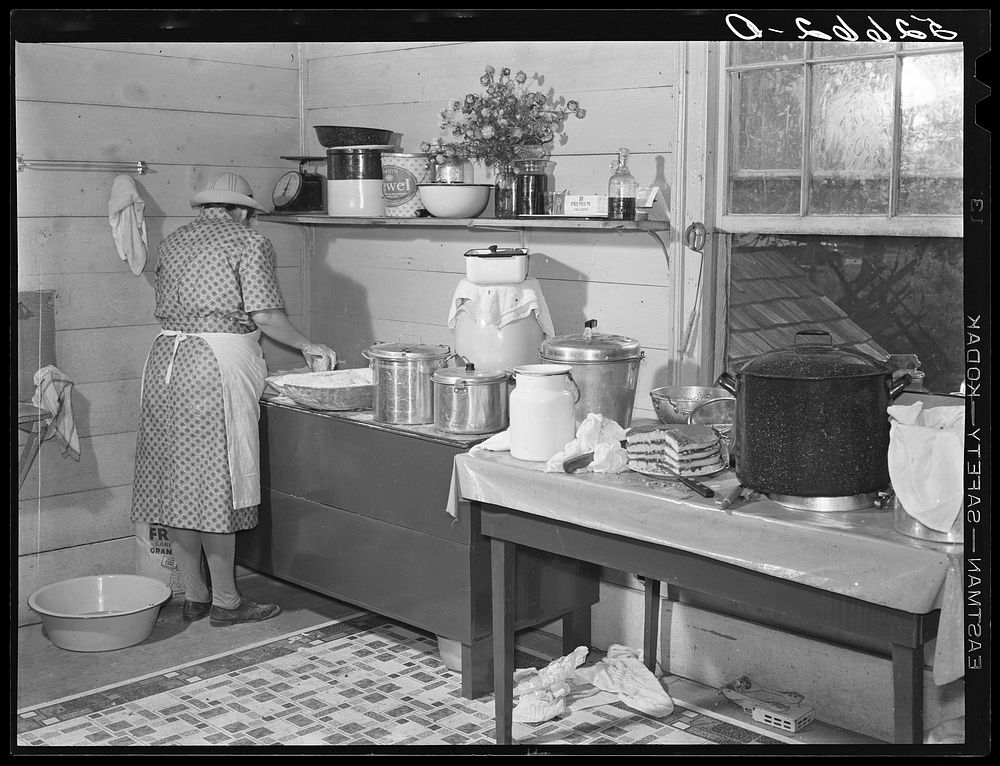 One of the Wilkins family making biscuits for dinner on corn-shucking day at home of Mrs. Fred Wilkins. Tallyho, near Stem…